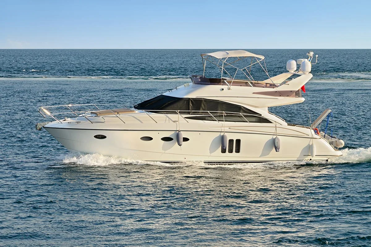 boat-charter-service-french-riviera-luxury-yacht-cruising Luxury yacht gliding through the sea on a private boat charter experience along the French Riviera.
