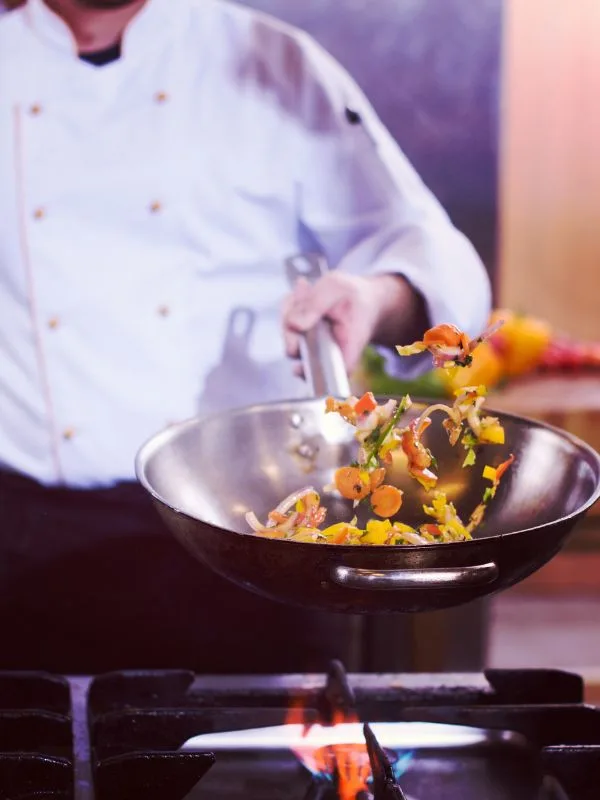 Private chef preparing gourmet meals in a luxury French Riviera villa.