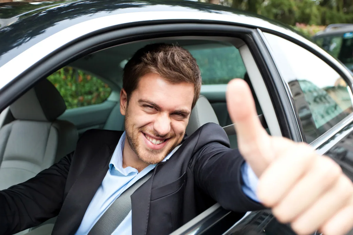 private-driver-service-french-riviera-vip-guest-experience Satisfied client enjoying private chauffeur service in a luxury car.