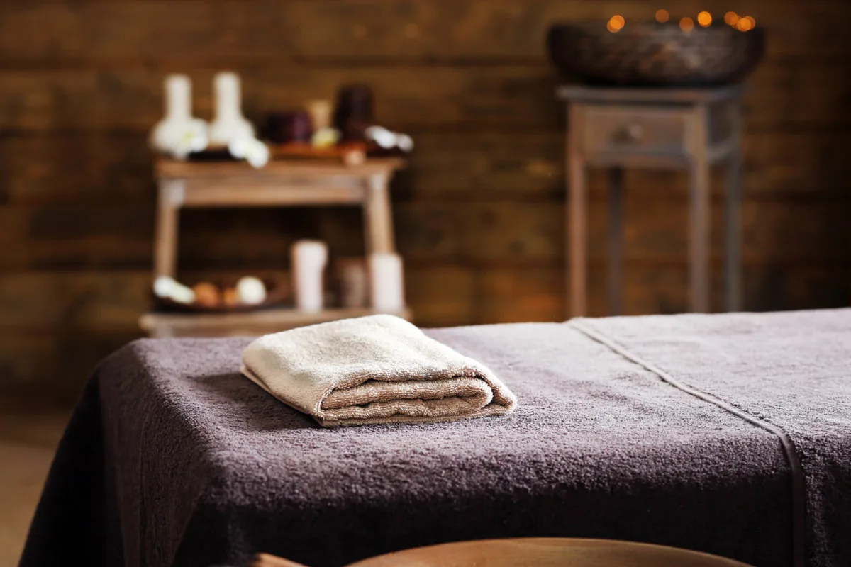 private-massage-service-french-riviera-villa-spa-room-setup Relaxing atmosphere in a French Riviera villa with massage table prepped for in-house therapy.