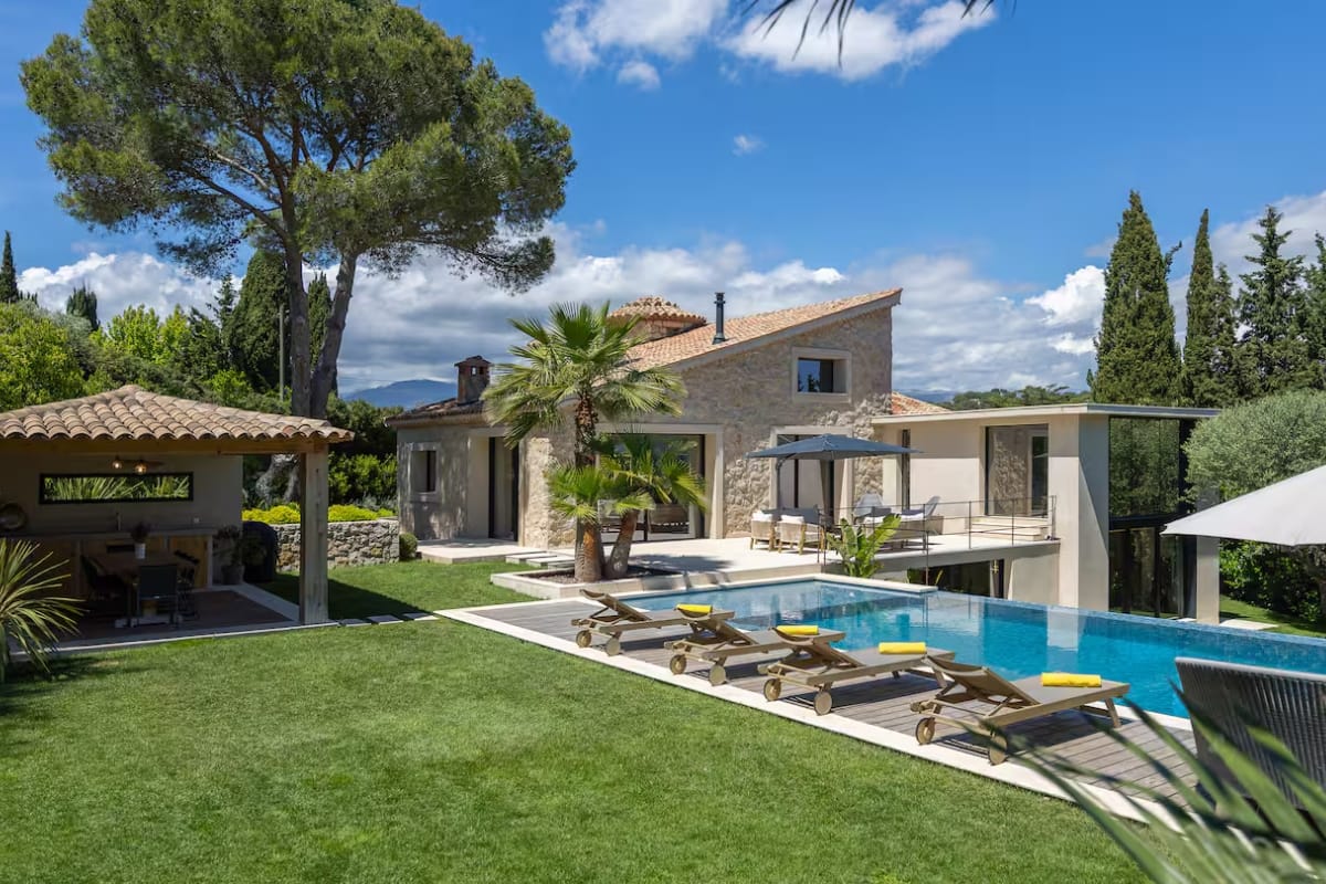 Wide aerial view of the estate showing Villa, its' pool area, landscaped gardens 